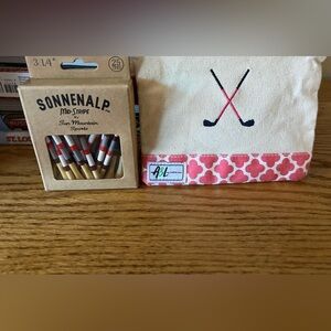 Women’s golf tee bag with box of unopened box of golf tees